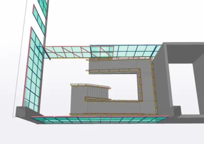 3D architectural model of a multi-story building featuring exposed staircases and structural elements, showing various construction details.
